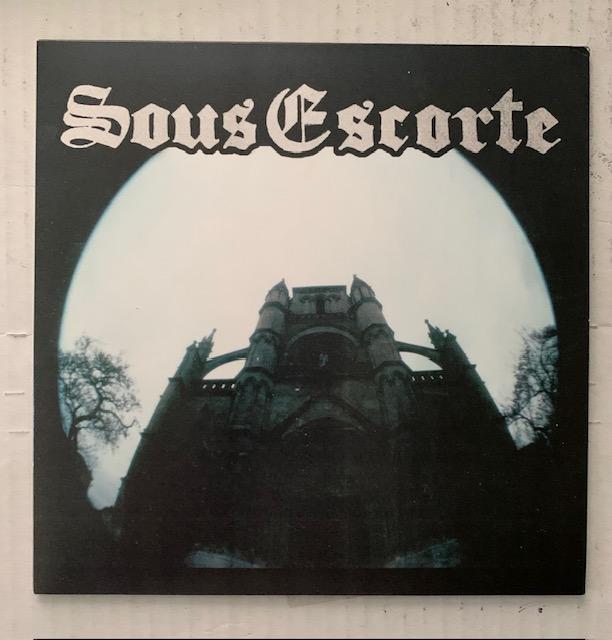 Sous Escorte-S/T-7"