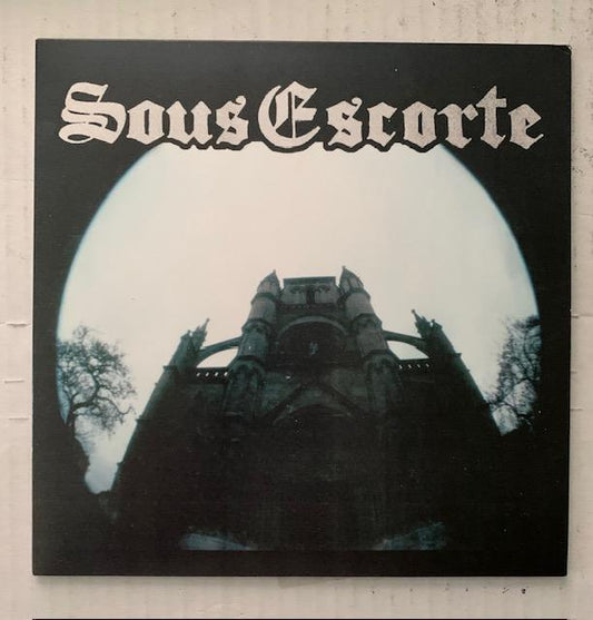 Sous Escorte-S/T-7"